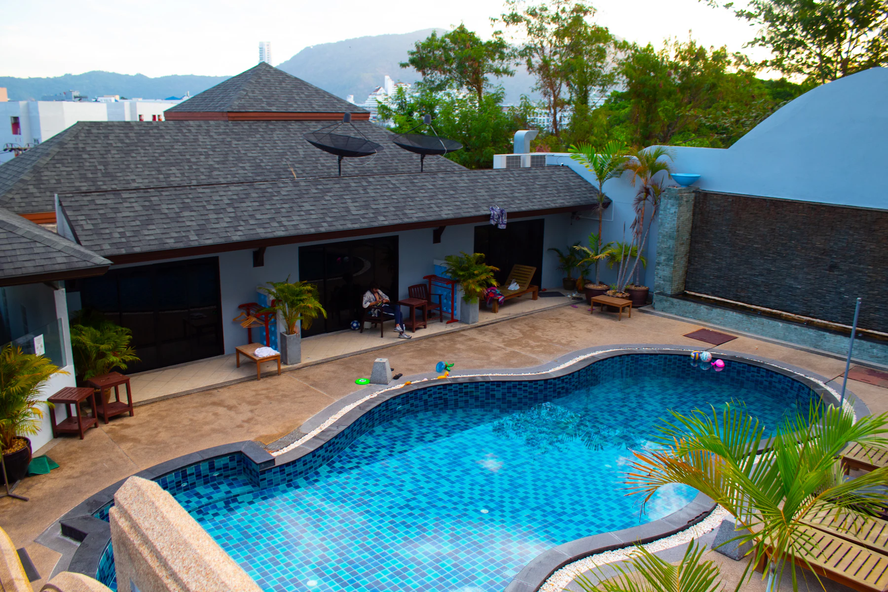 A swimming pool and Thai roof architecture in Phuket